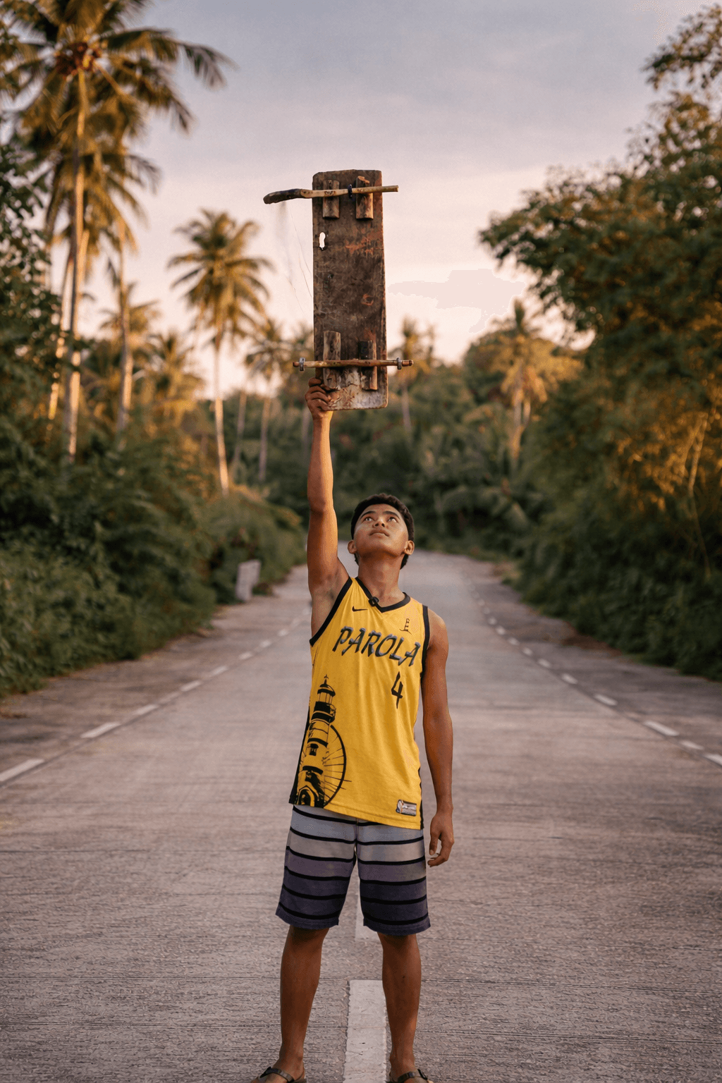 Pacific Kings — a Siargao skater holds a hand-made board
